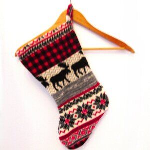 Christmas stocking decoration picturing moose & ponsettas to hold some goodies